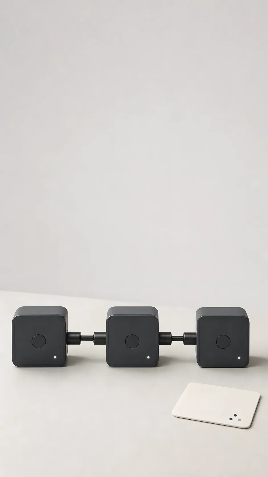Connected charcoal automation modules on a light studio background